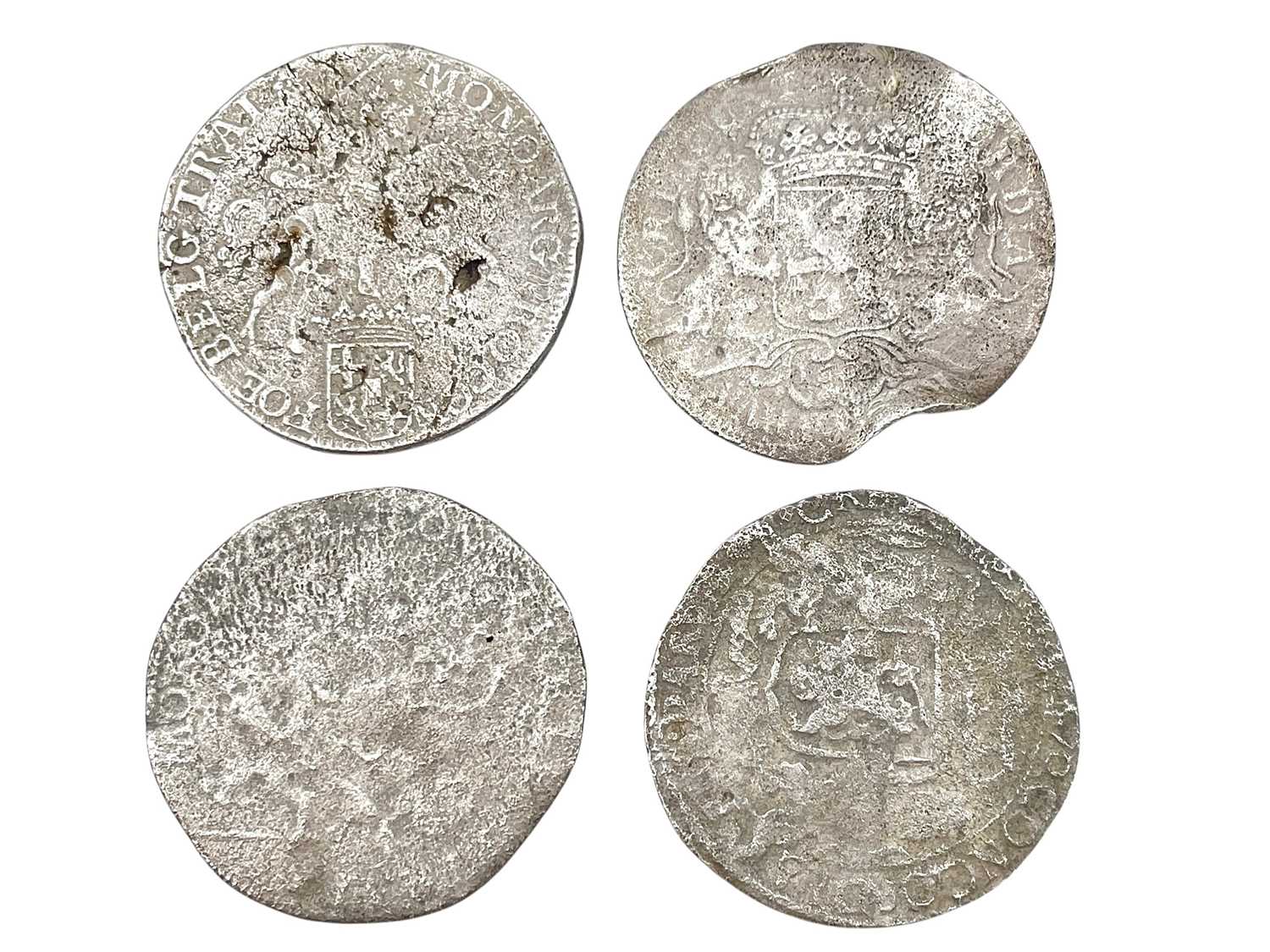 Lot 14 - SHIPWRECK COINS - A collection of four Spanish Netherlands 'horse and rider' silver ducaton coins.