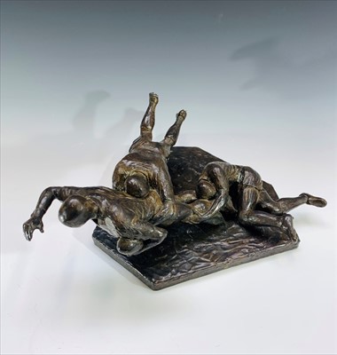 Lot 144 - A bronzed figure group of rugby players,...