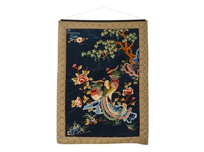 Lot 513 - A Chinese silk wall hanging, 20th century, embroidered with two fenghuang birds.