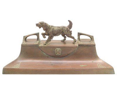 Lot 205 - An early 20th century German copper desk stand, surmounted by a spelter sculpture of a hunting dog.