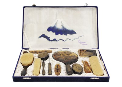 Lot 578 - A simulated tortoiseshell cased 12 piece dressing table set.