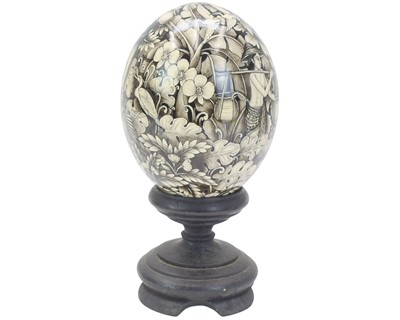 Lot 25 - A decorative Balinese painted ostrich egg.