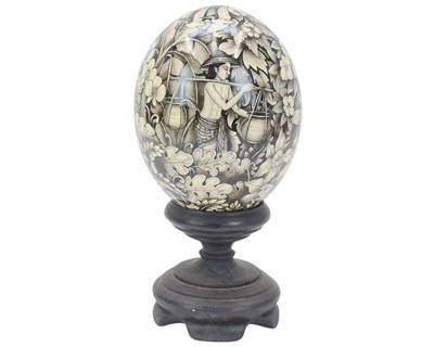 Lot 25 - A decorative Balinese painted ostrich egg.