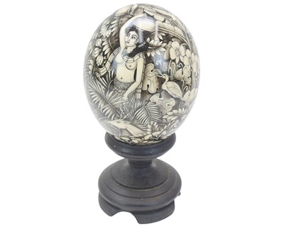 Lot 25 - A decorative Balinese painted ostrich egg.