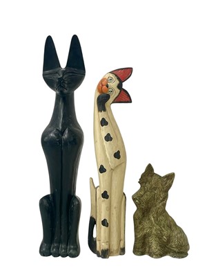 Lot 67 - A carved wood Egyptian-style cat.