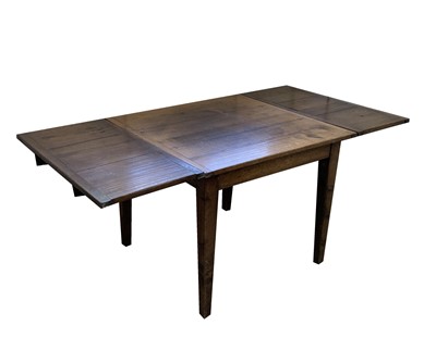 Lot 132 - An oak draw leaf dining table, early 20th...