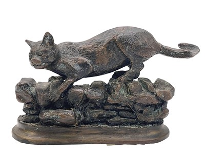 Lot 7 - After Jules Moigniez, a small bronze feline figure.