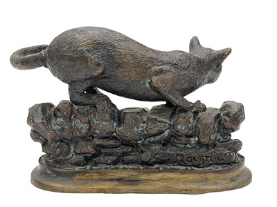 Lot 7 - After Jules Moigniez, a small bronze feline figure.