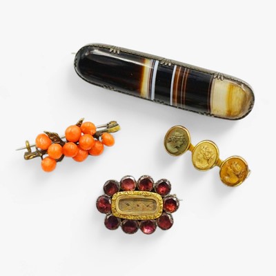 Lot 139 - A Georgian foiled garnet and gold mourning brooch, with three other brooches.