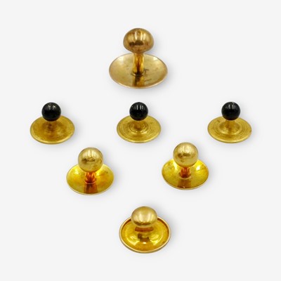 Lot 141 - A selection of seven gold and plated shirt buttons in a button box.