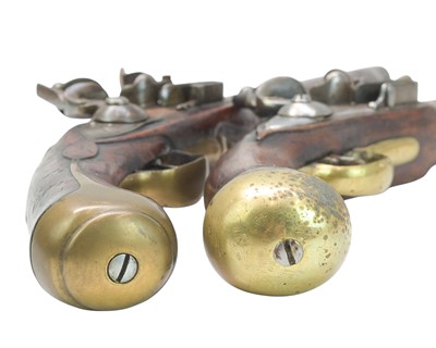 Lot 273 - Two reproduction brass mounted flintlock pistols.