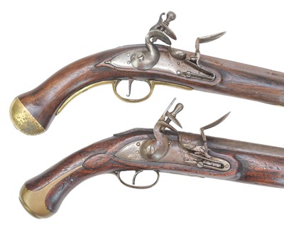 Lot 273 - Two reproduction brass mounted flintlock pistols.