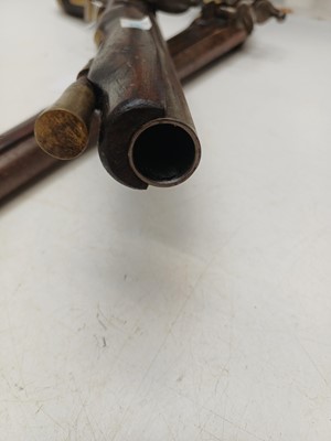 Lot 273 - Two reproduction brass mounted flintlock pistols.