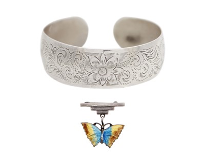 Lot 7 - A silver bangle bracelet by BIRKS, with an art deco silver and enamel butterfly brooch.