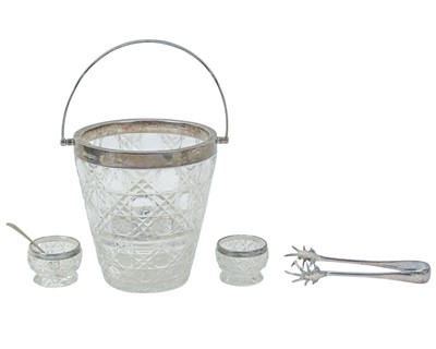 Lot 247 - An Edwardian cut glass ice bucket with silver rim, handle and strainer.