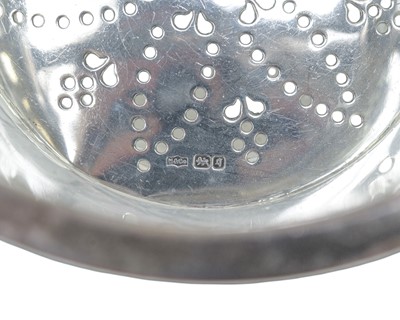 Lot 247 - An Edwardian cut glass ice bucket with silver rim, handle and strainer.