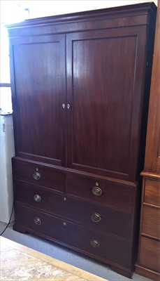 Lot 3433 - A George III mahogany linen press, with a pair...