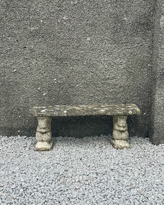 Lot 767 - A reconstituted stone bench.