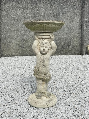 Lot 774 - A reconstituted stone bird bath.