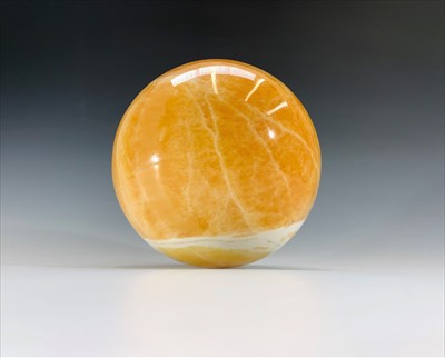 Lot 167 - A carved and polished hardstone ball. Diameter...