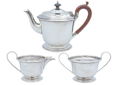 Lot 59 - A George VI silver three-piece tea set by John Rose.