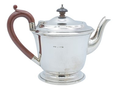 Lot 59 - A George VI silver three-piece tea set by John Rose.
