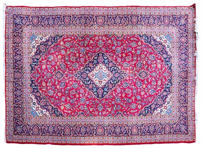Lot 689 - A Persian Kashan carpet.