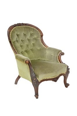 Lot 879 - A Victorian walnut framed buttonback armchair.