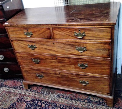 Lot 3459 - A Georgian mahogany chest of drawers, with two...