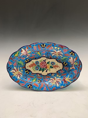 Lot 909 - An Emaux de Longwy oval brightly decorated...