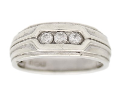 Lot 9 - A 9k white gold and diamond band ring.