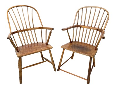 Lot 854 - A rustic ash stick back Windsor elbow chair.