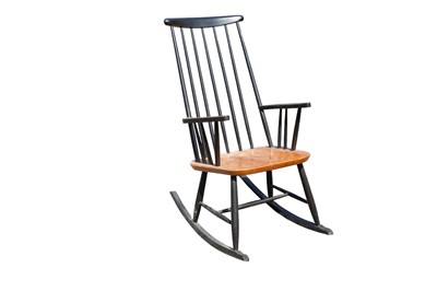 Lot 716 - A 20th century Scandinavian ebonised and teak rocking chair.