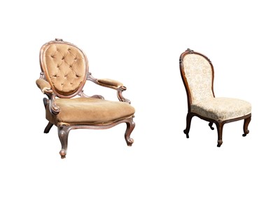 Lot 856 - Two Victorian carved walnut framed nursing chairs.