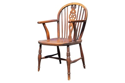 Lot 876 - A late 19th century ash and elm wheel back Windsor chair.