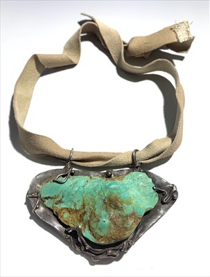 Lot 2434 - A Helen Feiler silver pendant set with turquoise.