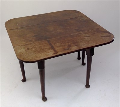 Lot 3449 - A George III mahogany drop leaf dining table,...