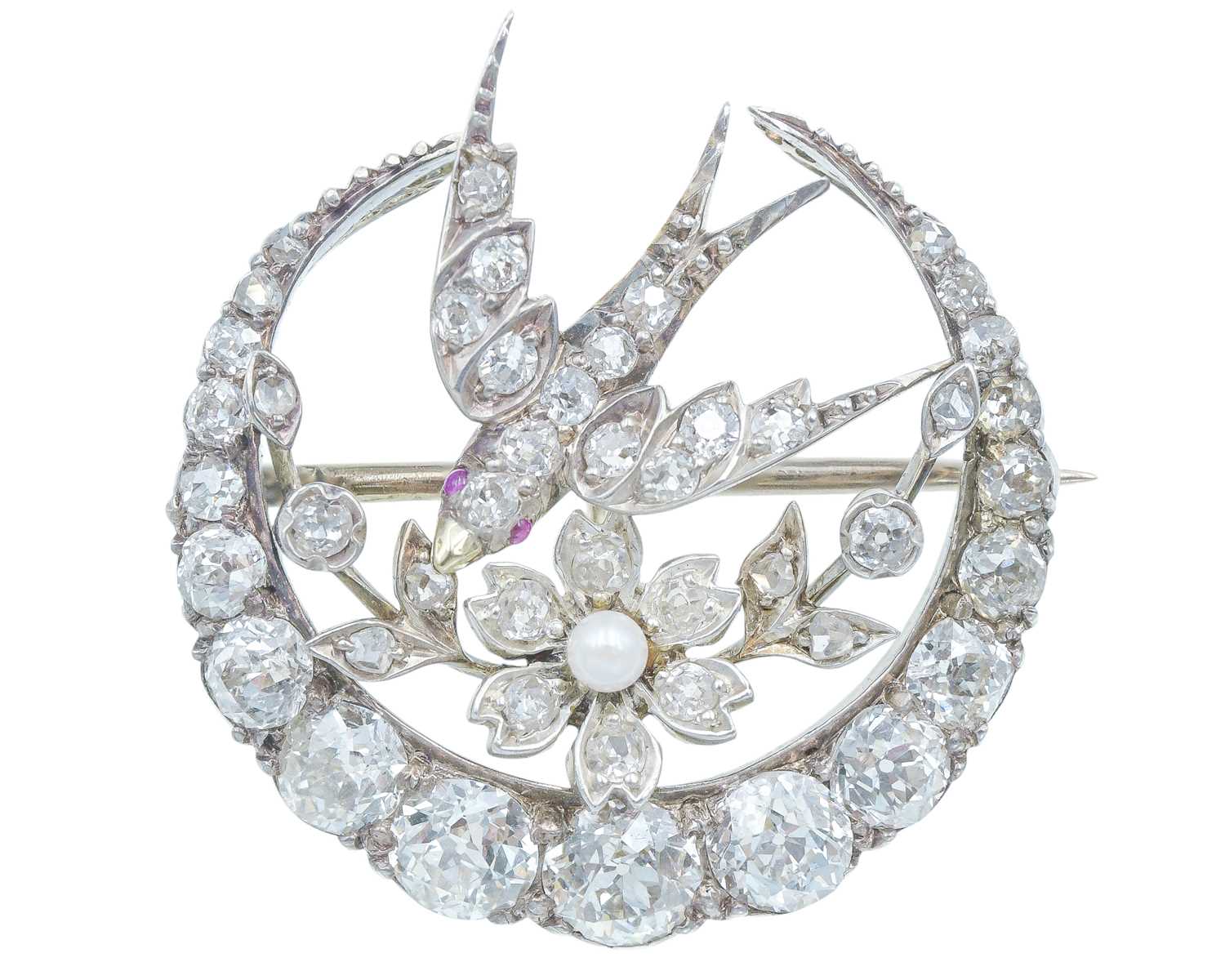 Lot 144 - A Scottish Victorian diamond and seed pearl crescent and swallow bird brooch by Aitchison.