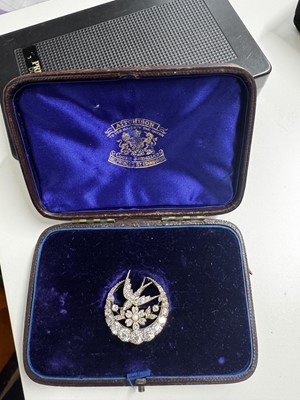 Lot 144 - A Scottish Victorian diamond and seed pearl crescent and swallow bird brooch by Aitchison.