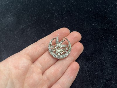 Lot 7 - A Scottish Victorian diamond and seed pearl crescent and swallow bird brooch by Aitchison.