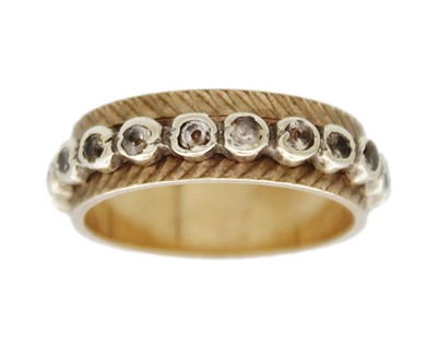 Lot 46 - A 9k gold rock crystal set eternity band ring.
