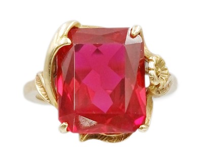 Lot 90 - A 9k gold synthetic ruby dress ring.