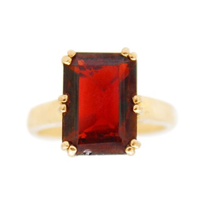 Lot 52 - A 9k gold garnet set dress ring.