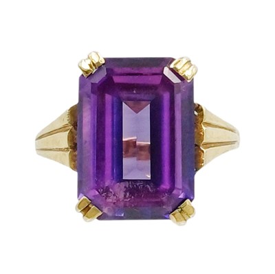 Lot 133 - A 9k gold amethyst set dress ring.