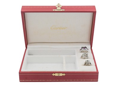 Lot 114 - A CARTIER jewellery box with some rings.