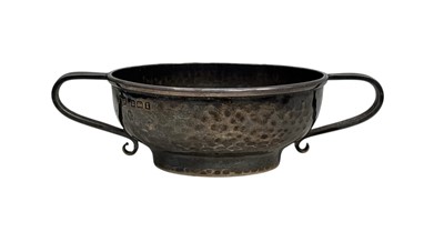 Lot 120 - An Edwardian Arts & Crafts silver twin-handled small bowl by A. E. Jones.
