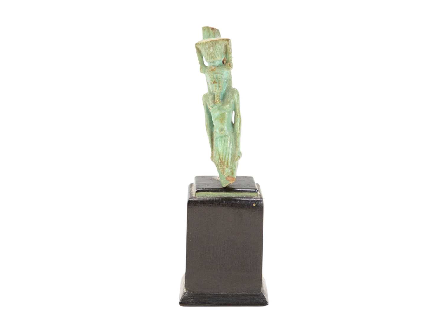 Lot 30 - An Egyptian faience amulet of a deity.
