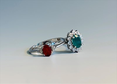 Lot 2623 - An 18ct white gold ring set an oval diamond...