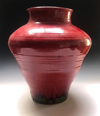 Lot 105 - A large Chris Pindl studio pottery red glazed...