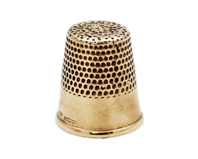Lot 162 - A 9k rose gold child's thimble.